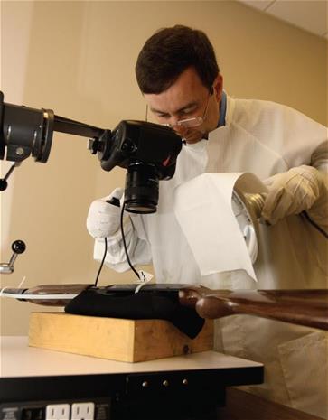 Identification unit capturing fingerprints off of a rifle